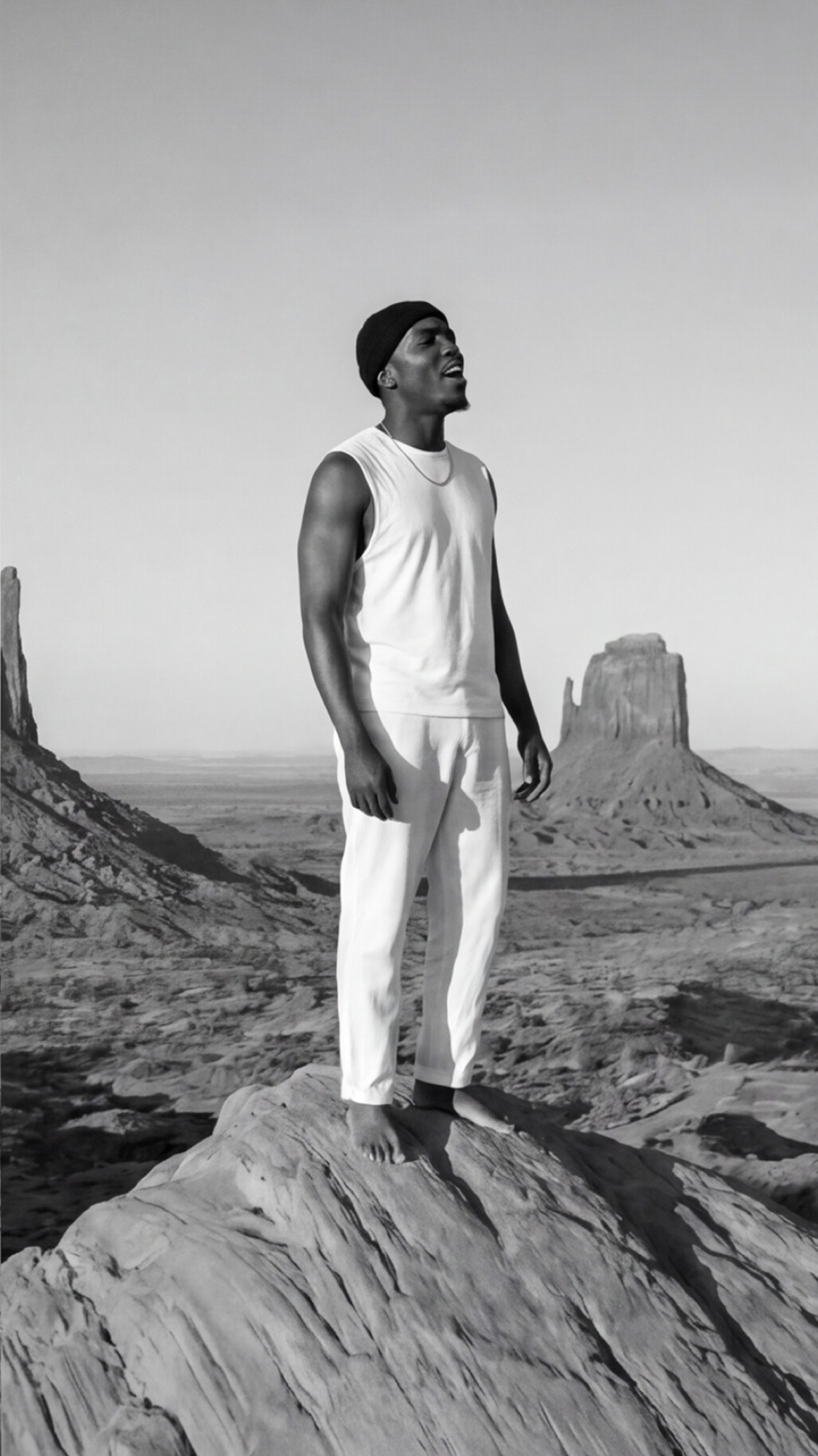 Noah Priest, alone in the desert, arms open to the sky